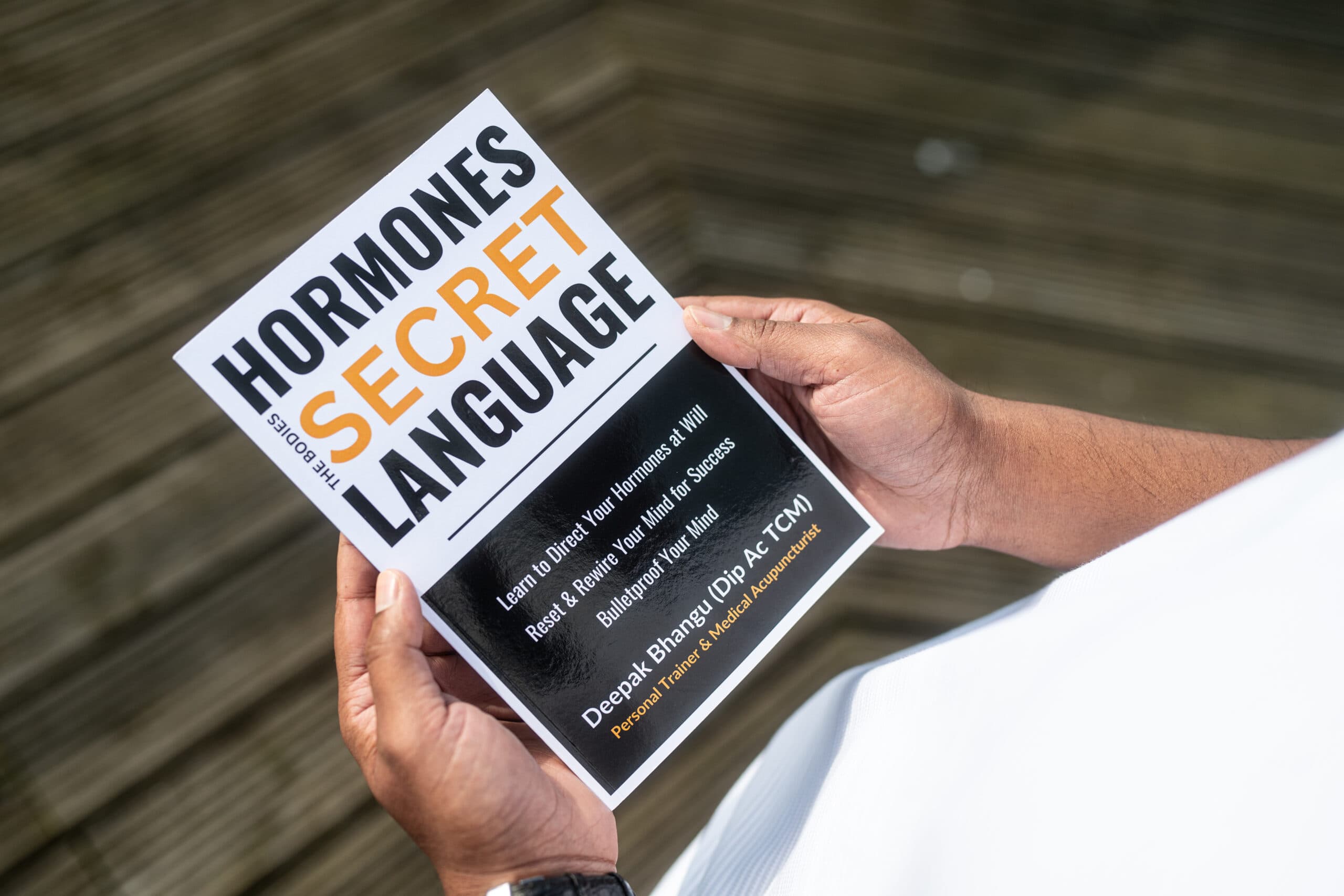 Deepak Bhangu holding Hormones: The Body's Secret Language