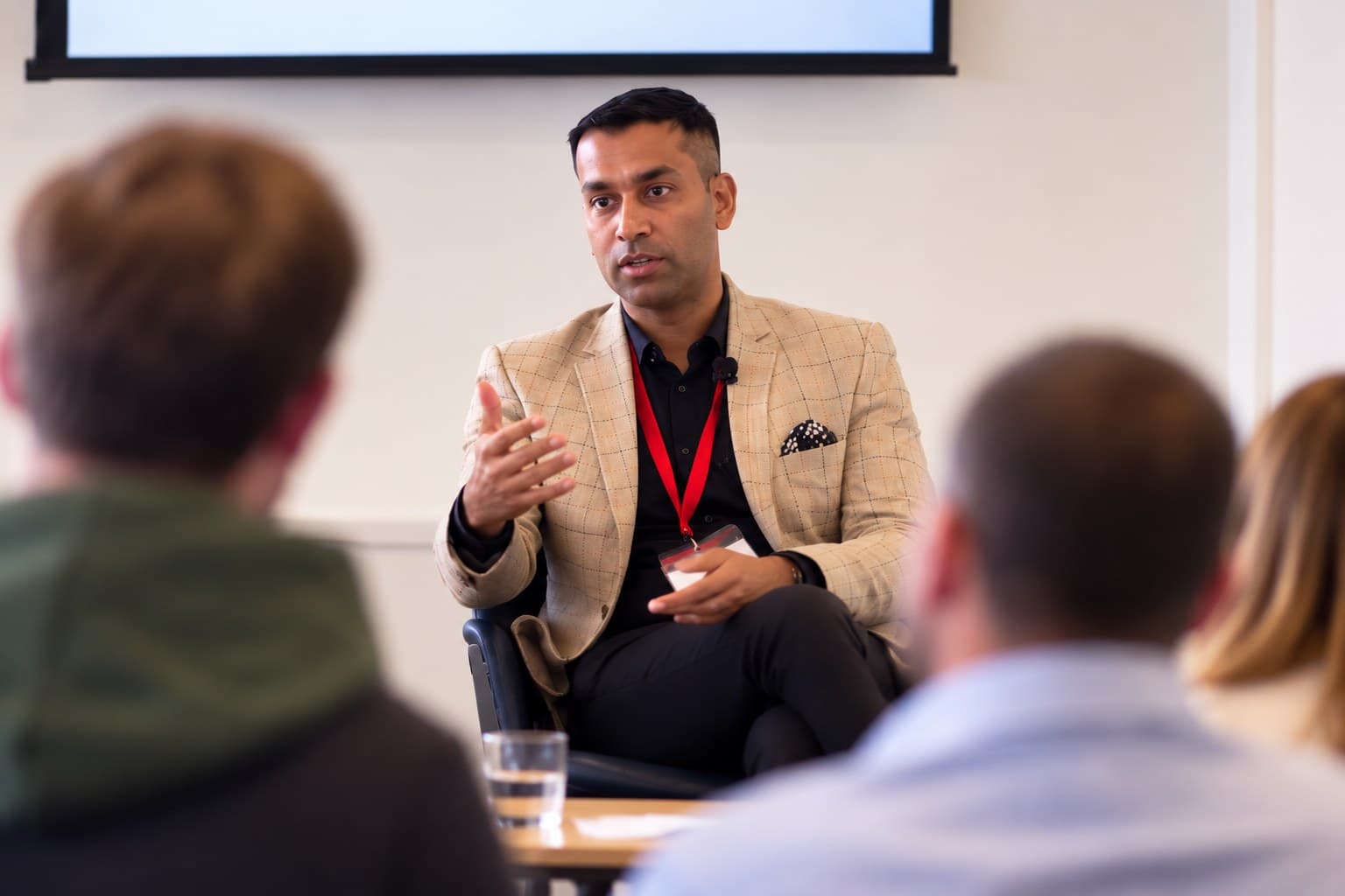 Deepak Bhangu delivering a corporate wellbeing talk on hormone health